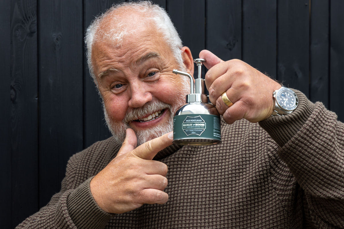 Cliff Parisi holding a Manley & Moosh face moisturiser canister
